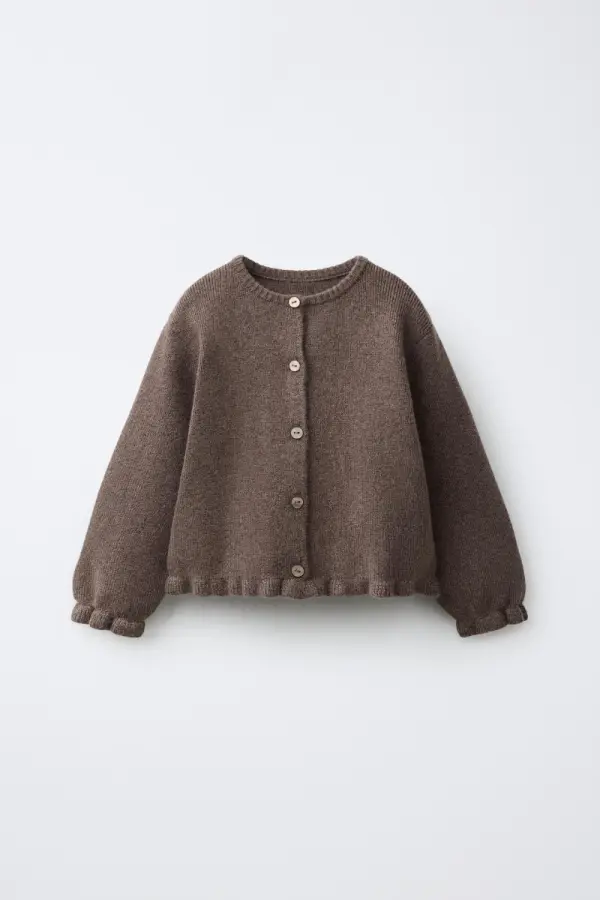 STRICKJACKE MIT VOLANT - фото товара
