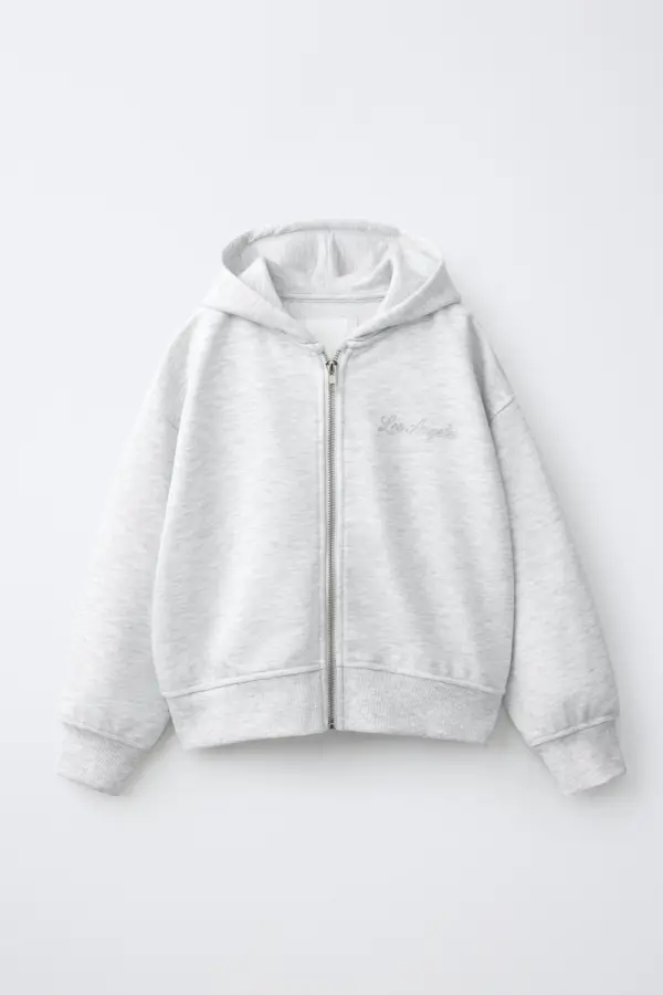 Sweatshirt mit Reissverschluss und Pailletten-Fluegeln - фото товара